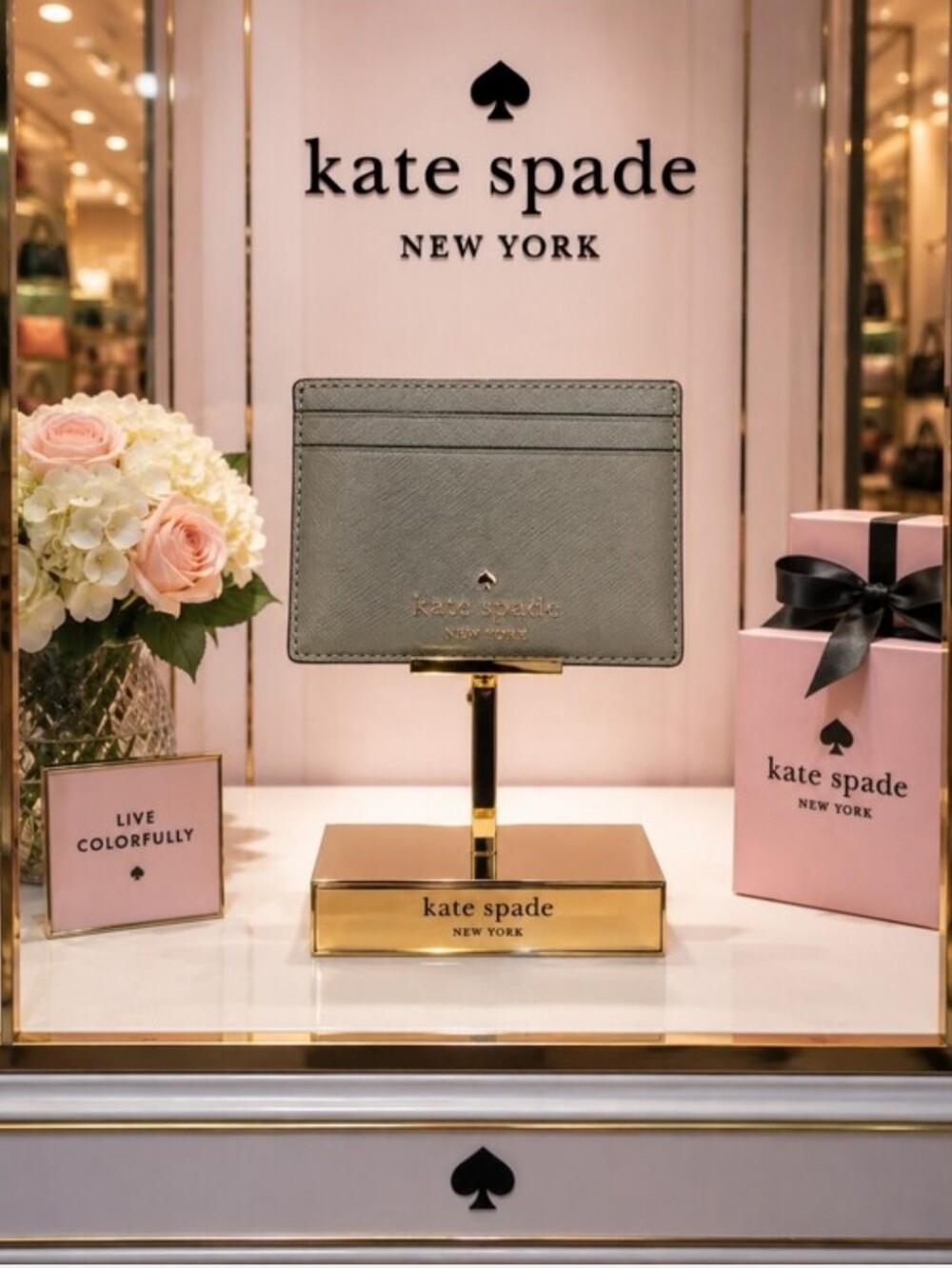 kate spade sage green card holder with gold logo